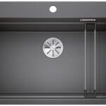 Dark gray single-bowl kitchen sink with a centered stainless drain and a built-in metal drying rack on the right side of the basin.