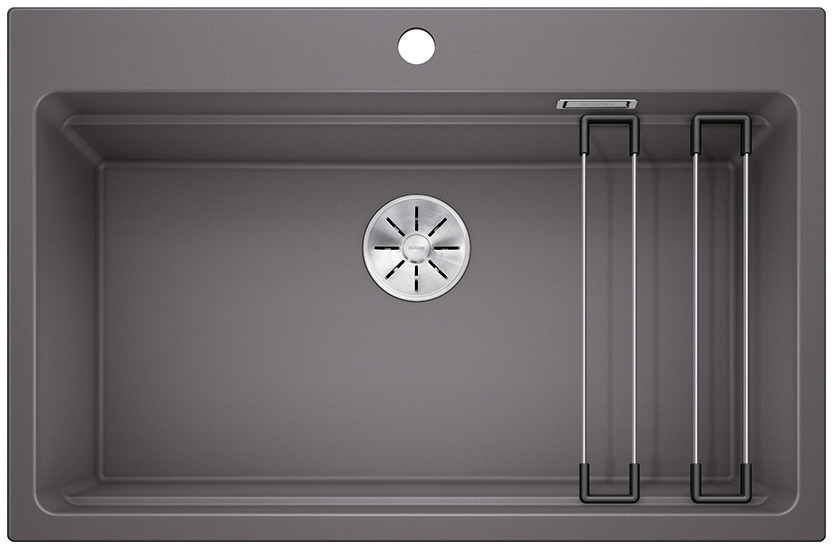 01232012_C_Web-PPT-JPG_150dpi_17043 - Τσιντώνης Πλακάκια Rectangular dark gray kitchen sink with a round stainless drain in the center and a vertical metal drying rack on the right side inside the basin.