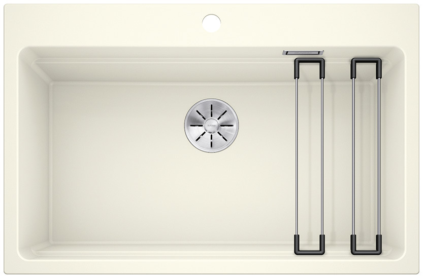 01232016_C_Web-PPT-JPG_150dpi_17051 - Τσιντώνης Πλακάκια Top-down view of a beige kitchen sink with a round drain in the center and two metal drying racks on the right side.