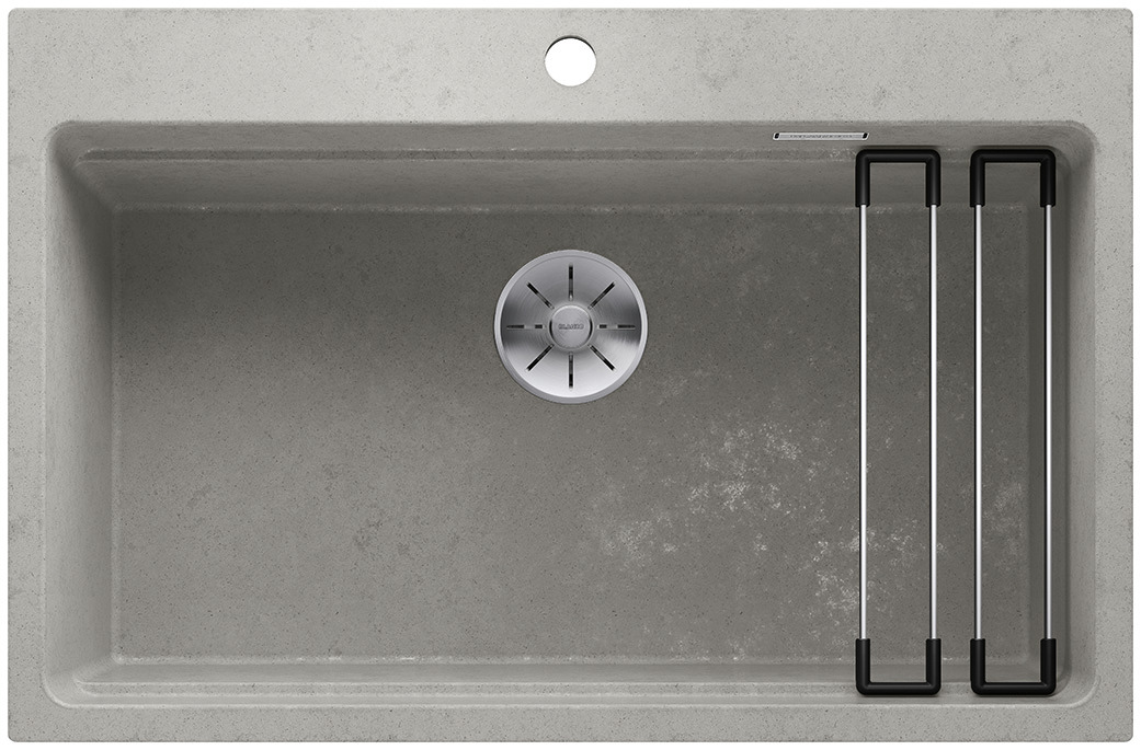 01232042_C_Web-PPT-JPG_150dpi_17103 - Τσιντώνης Πλακάκια Top-down view of a gray kitchen sink with a circular drain and a metal drying rack on the right side.