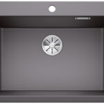 Dark gray single-basin kitchen sink with center drain and a mounting hole at the top edge, no faucet installed.