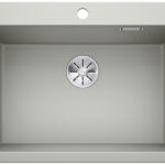 Top-down view of a gray rectangular kitchen sink with a circular metal drain in the center.