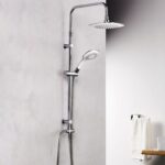 Chrome shower system with a ceiling rain head and a handheld spray in a modern bathroom.
