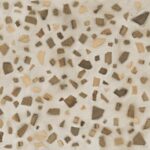Terrazzo floor pattern with irregular brown, beige, and cream chips embedded in a light grout.