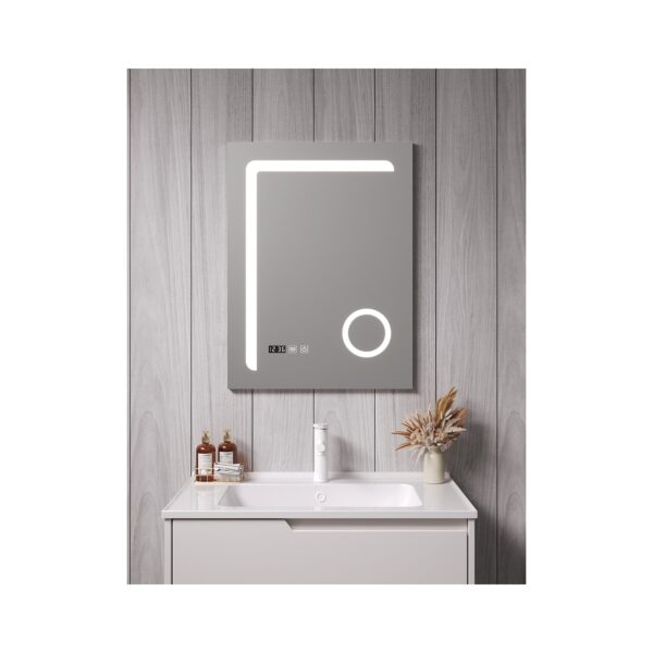 Modern bathroom with a backlit rectangular mirror above a grey vanity, set against wood-paneled walls with a white sink and soap bottles.