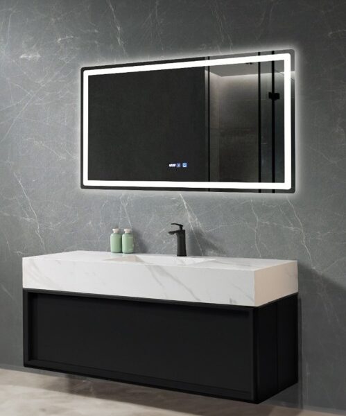 Modern bathroom vanity with marble countertop, black cabinet, and a backlit rectangular mirror on a gray marble wall.