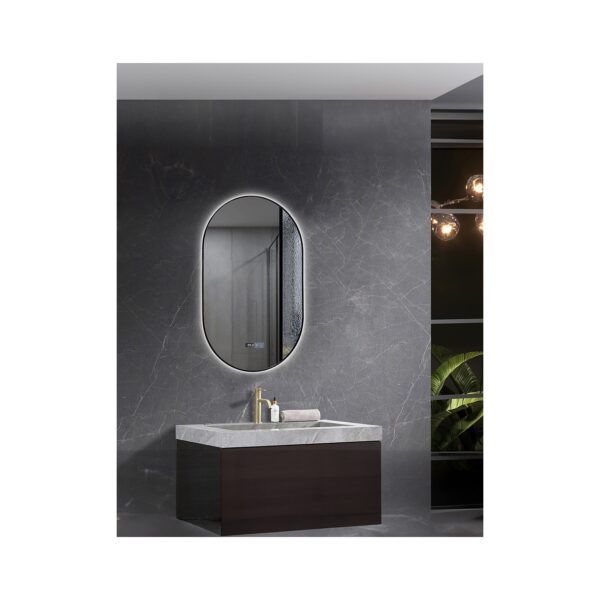 Contemporary bathroom with dark marble walls, an oval backlit mirror, and a marble-topped vanity with a gold faucet; shelving and warm lights visible to the right.