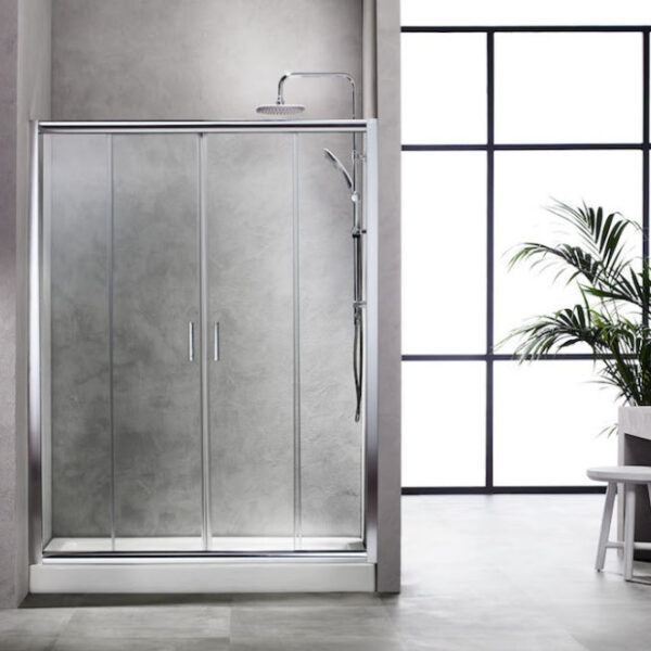 Modern glass shower enclosure with sliding doors in a gray bathroom, near a large window and a potted plant.