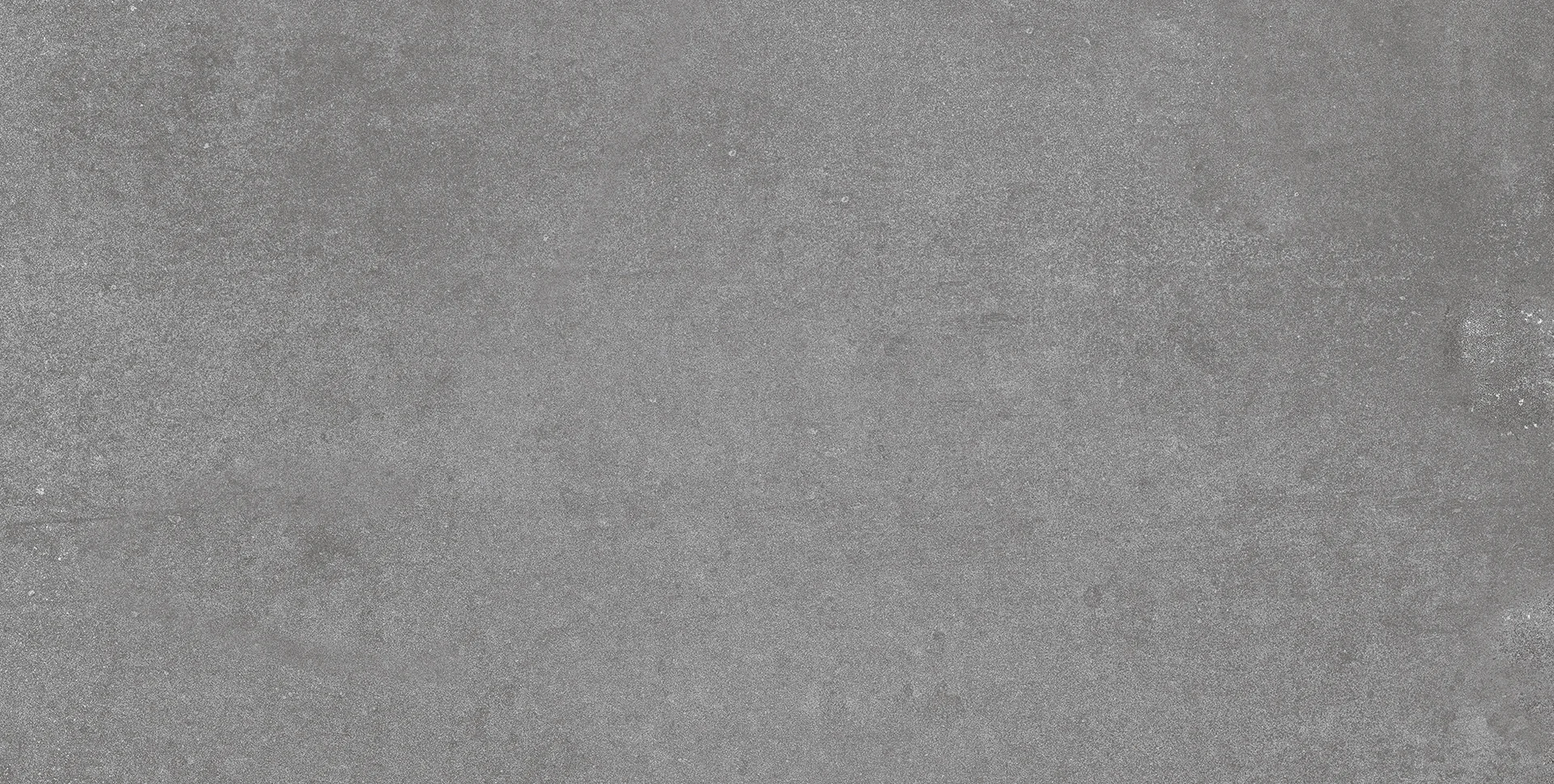 24056000000564-5 1 - Τσιντώνης Πλακάκια Close-up of a rough, gray concrete surface with speckled texture