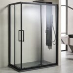 Black-framed glass shower enclosure installed in a modern bathroom, featuring a wall-mounted shower panel with a handheld sprayer inside.