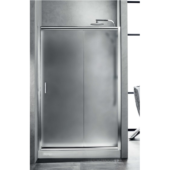 Frameless shower enclosure with frosted glass doors and chrome hardware in a modern bathroom setting.