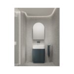 Modern bathroom with textured gray walls, an arched mirror above a white sink and a dark blue cabinet outside the frame of the image edge.